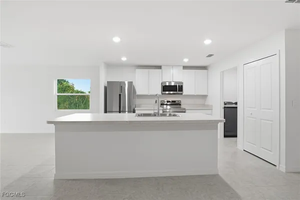 a view of kitchen with wooden floor