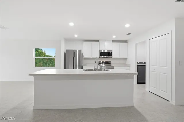 a view of kitchen with wooden floor