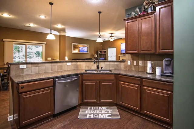 a view of a dining room with furniture and window