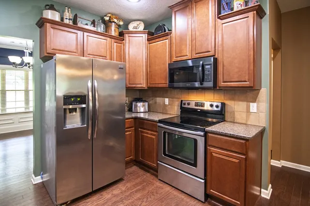 a view of entryway with wooden floor and stairs