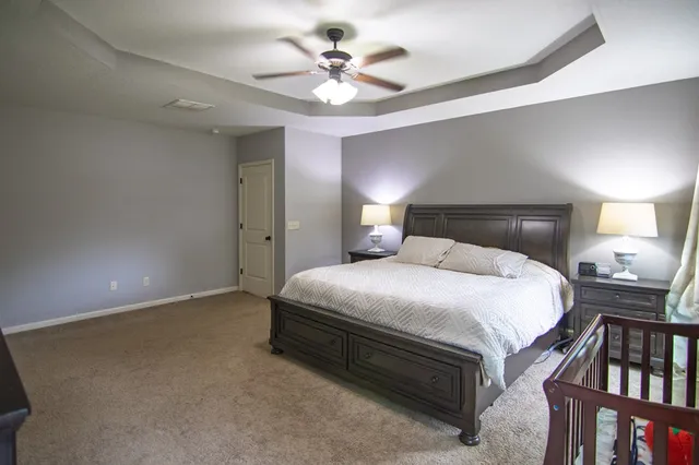 a bathroom with a sink toilet a mirror and shower