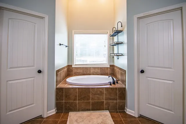 a bed room with a bed and a chandelier