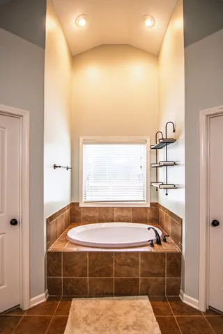 a view of a swimming pool with a backyard and trees