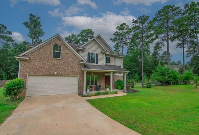 a view of a chairs and table in a patio