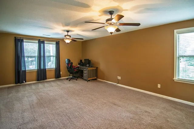 a view of a garage with parked cars
