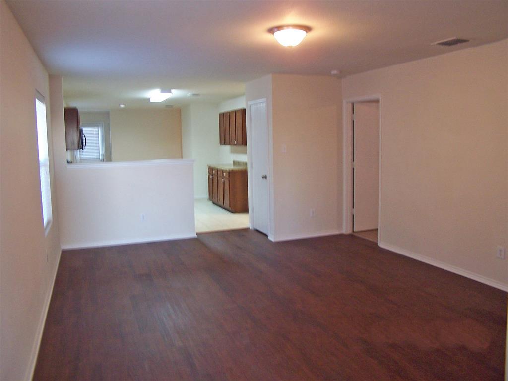 8844 Valley River Drive Fort Worth, TX 76244 - Photo 5 of 13 a view of a hallway with wooden floor