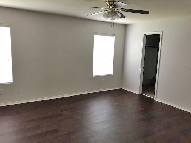 8844 Valley River Drive Fort Worth, TX 76244 - Photo 6 of 13 an empty room with wooden floor chandelier fan and windows