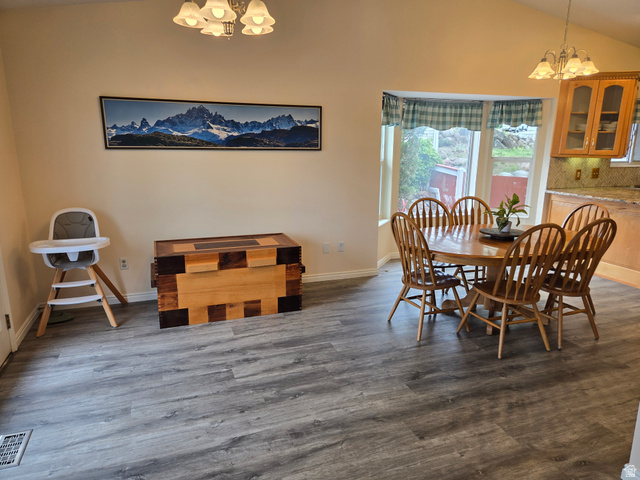 1263 Grayson Court Sandy, UT 84094 - Photo 5 of 26 Spacious dining area featuring a bay window, and vaulted ceilings
