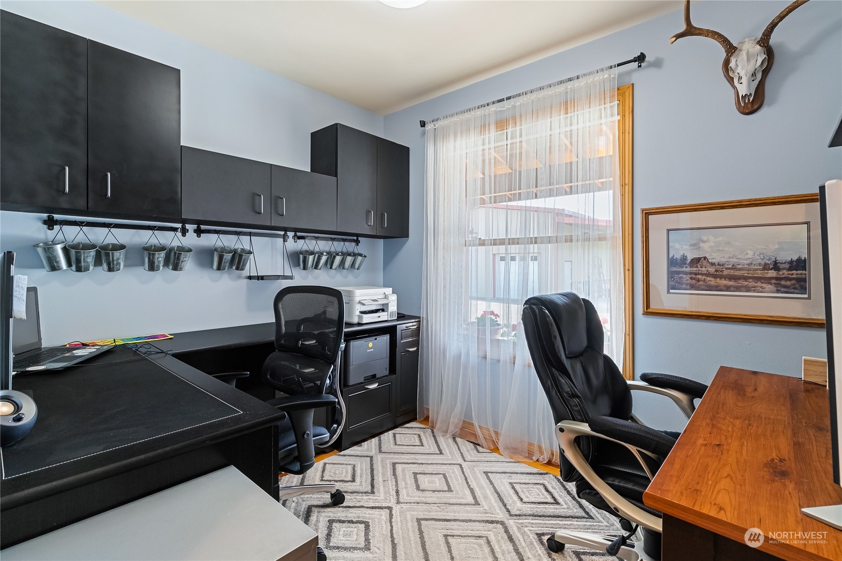 852 Lange Road Bellingham, WA 98226 - Photo 11 of 40 a view of a workspace with furniture and a window