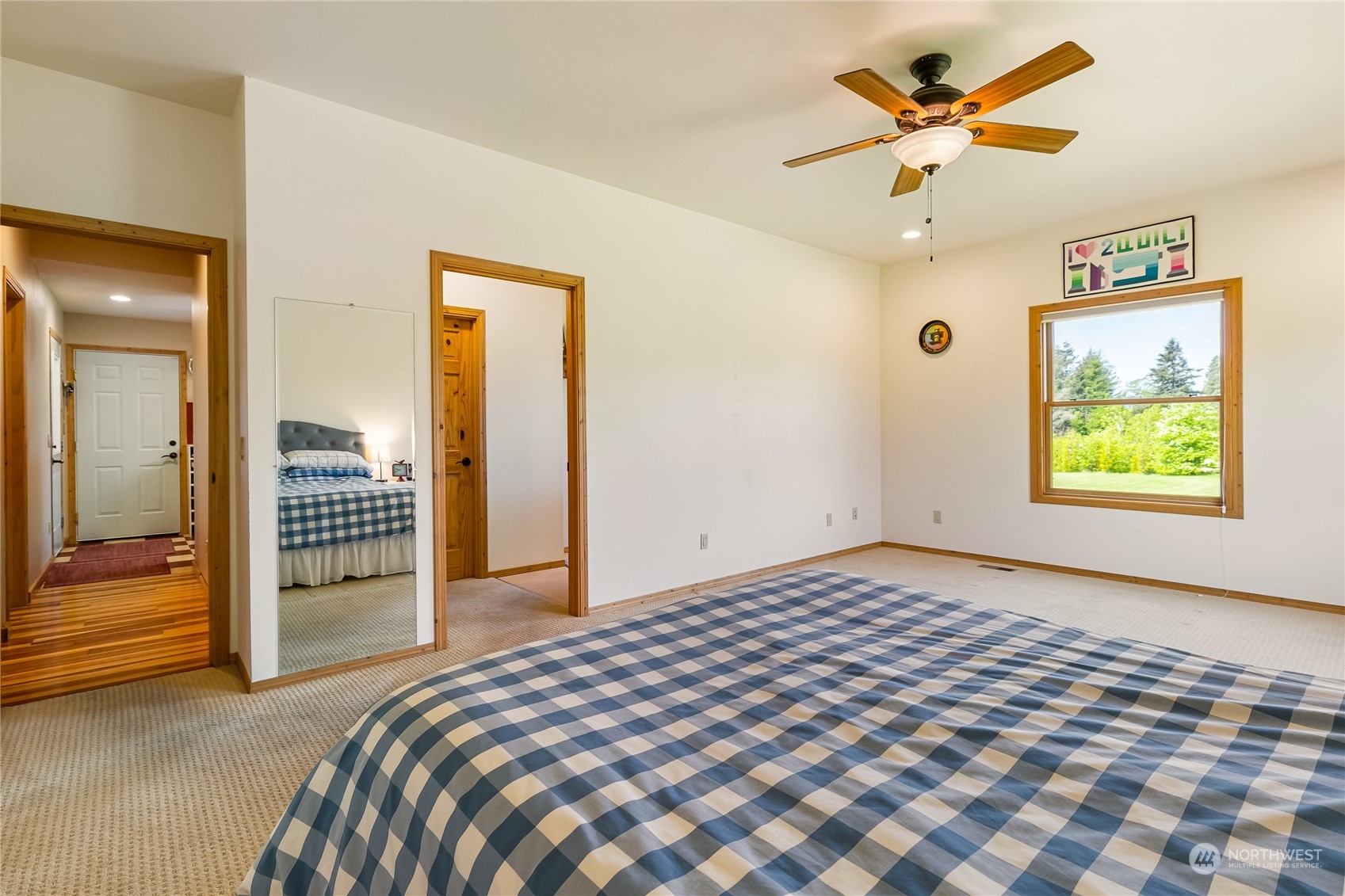 852 Lange Road Bellingham, WA 98226 - Photo 13 of 40 a bedroom with a bed and a chandelier