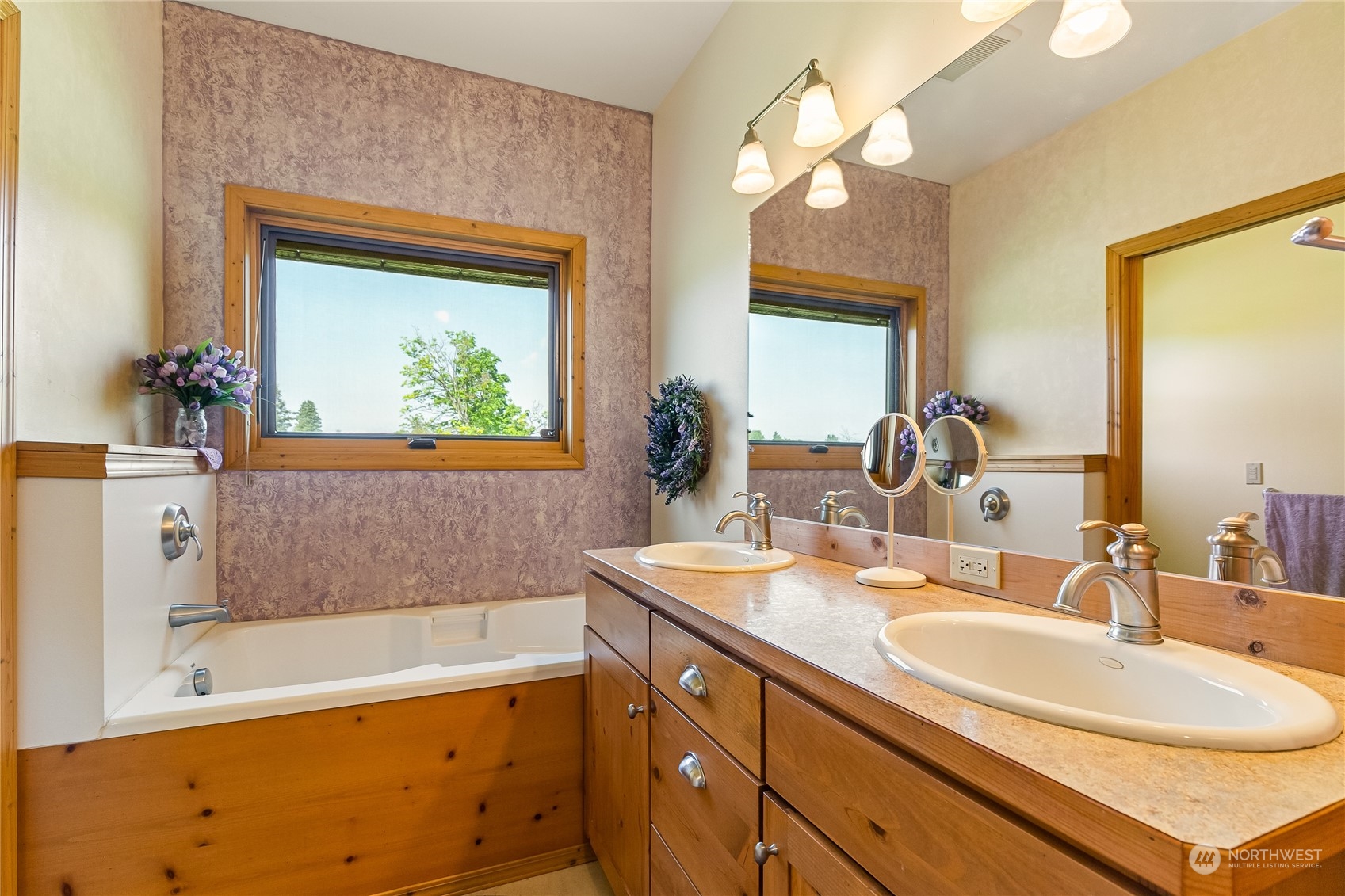 852 Lange Road Bellingham, WA 98226 - Photo 15 of 40 a bathroom with a tub a sink and a mirror