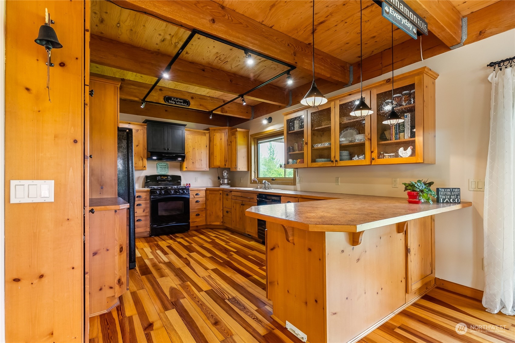 852 Lange Road Bellingham, WA 98226 - Photo 6 of 40 a room with wooden cabinets and stainless steel appliances
