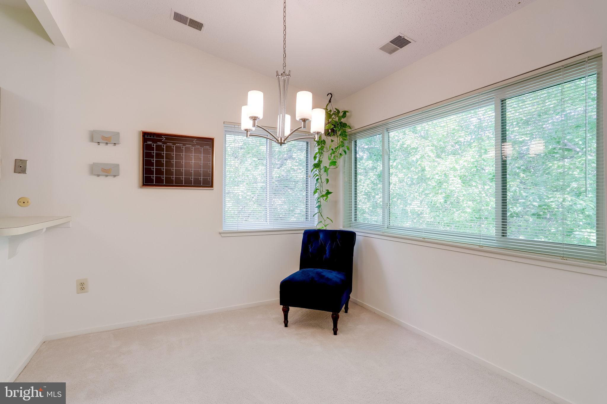 11027 Villaridge Court Reston, VA 20191 - Photo 10 of 28 a living room with furniture and a large window