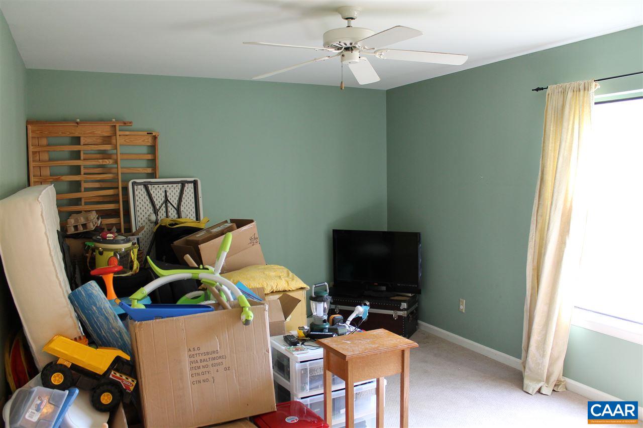 11 Dogleg Road Palmyra, VA 22963 - Photo 11 of 28 a living room with furniture a flat screen tv and a window