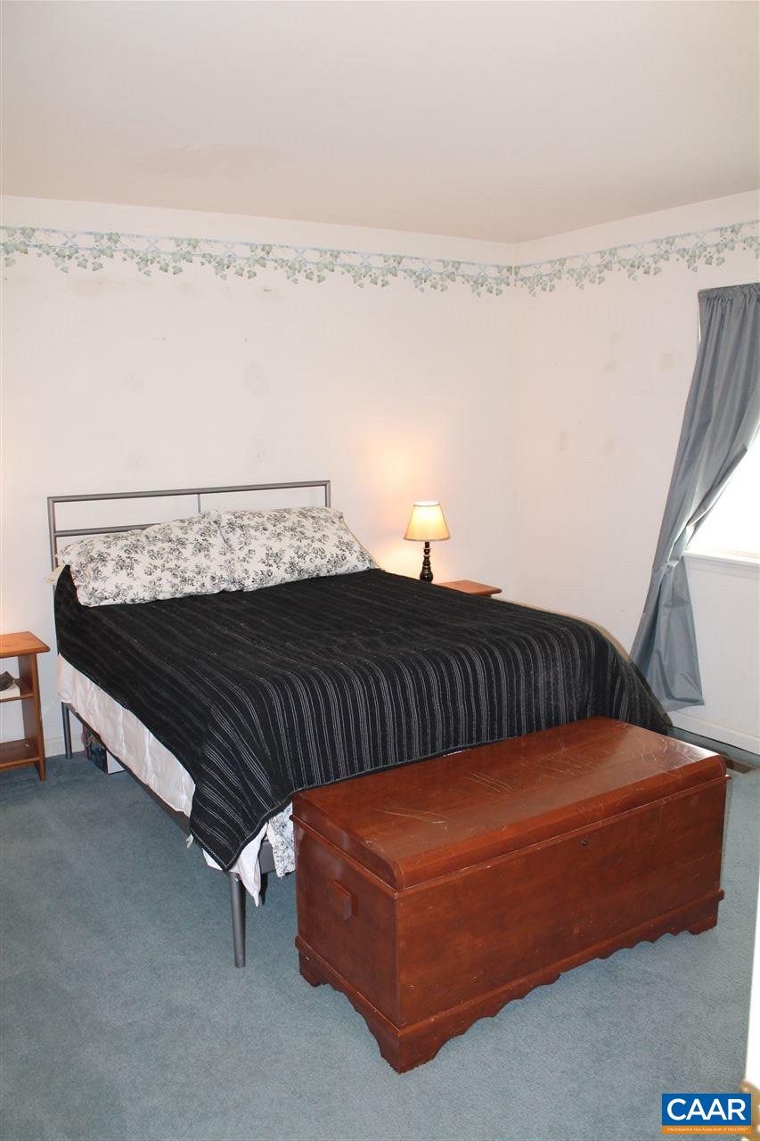 11 Dogleg Road Palmyra, VA 22963 - Photo 20 of 28 a bedroom with a bed and cabinet