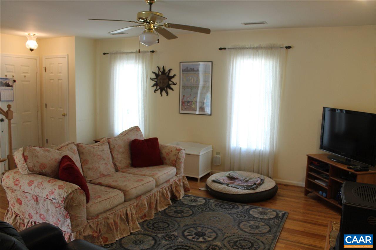 11 Dogleg Road Palmyra, VA 22963 - Photo 3 of 28 a living room with furniture and a flat screen tv