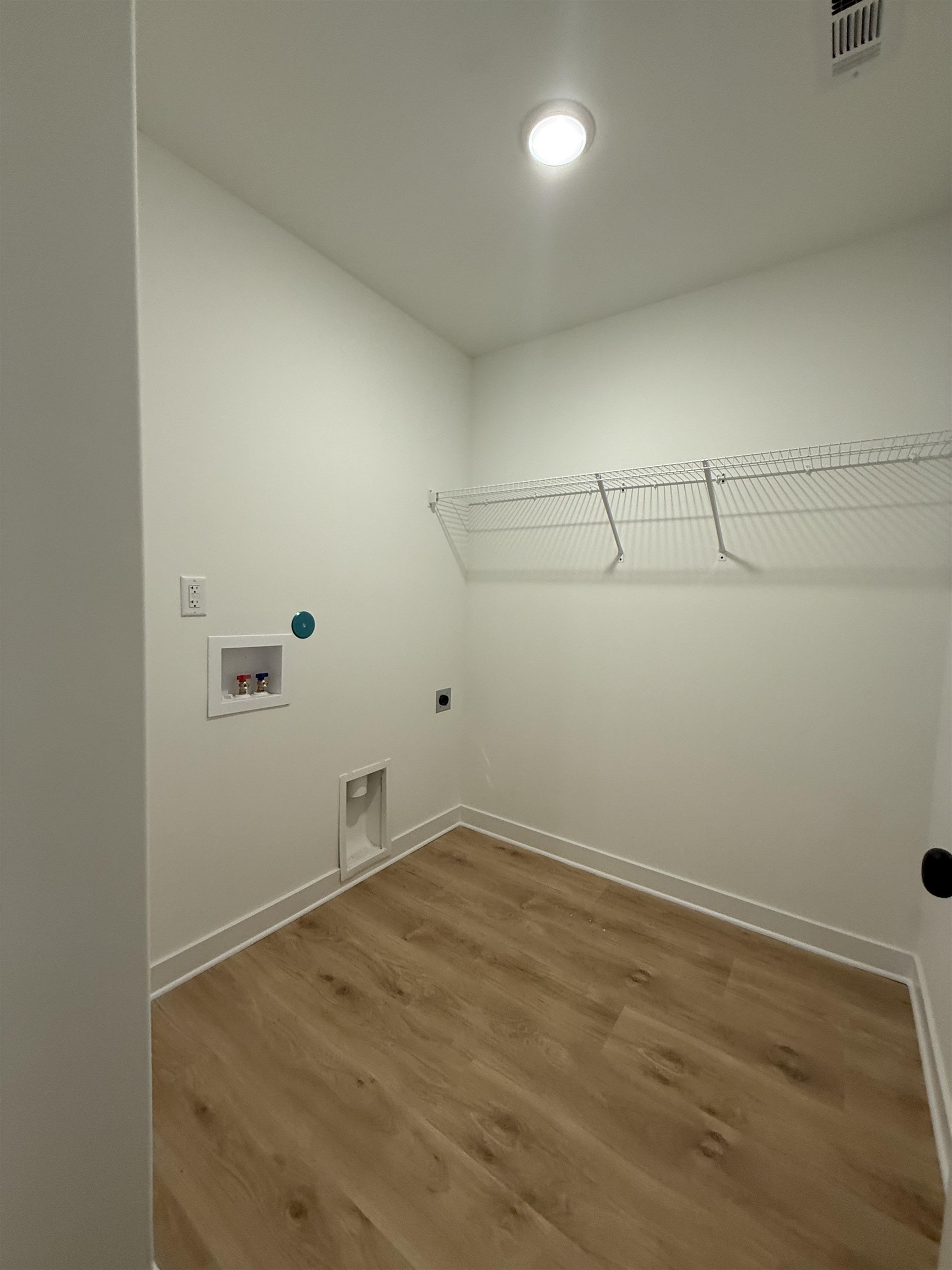 6888 Talcott Lane Bartlett, TN 38135 - Photo 14 of 16 a view of a room with racks on the wall