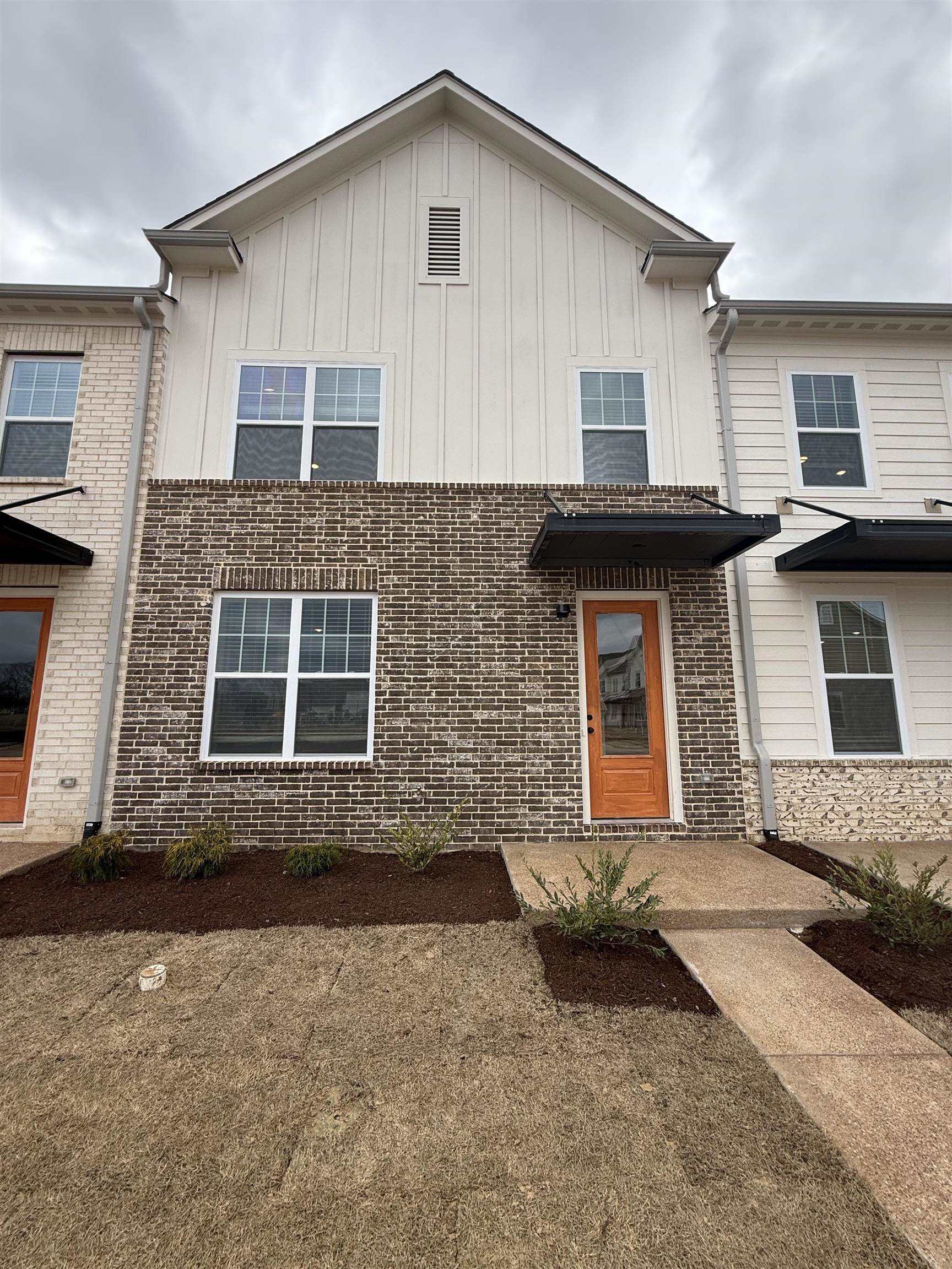 6888 Talcott Lane Bartlett, TN 38135 - Photo 3 of 16 a front view of a house with a yard