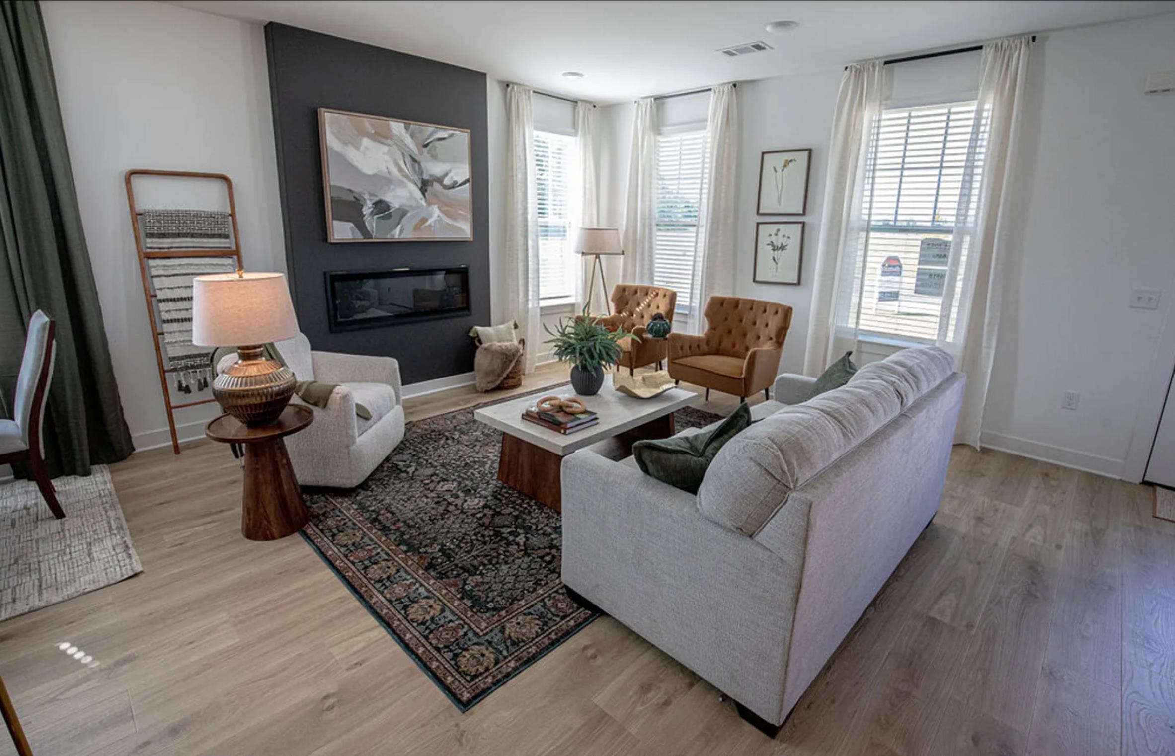 6888 Talcott Lane Bartlett, TN 38135 - Photo 8 of 19 Living area featuring a glass covered fireplace and light wood finished floors