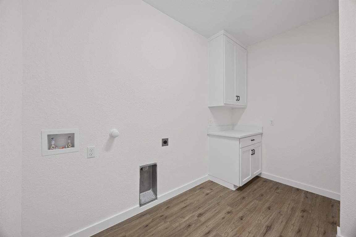 17701 Village Drive Dripping Springs, TX 78620 - Photo 15 of 36 an empty room with wooden floor