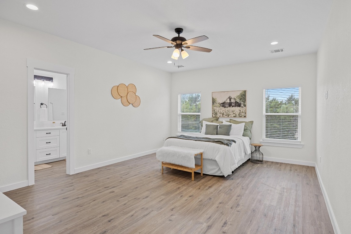 17701 Village Drive Dripping Springs, TX 78620 - Photo 16 of 36 a bed room with a bed and a window