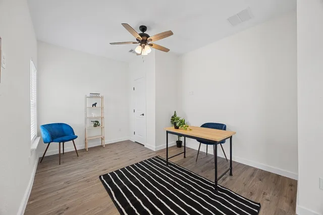 a view of entryway with wooden floor