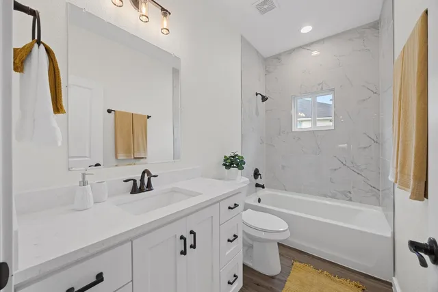 a backyard of a house with table and chairs