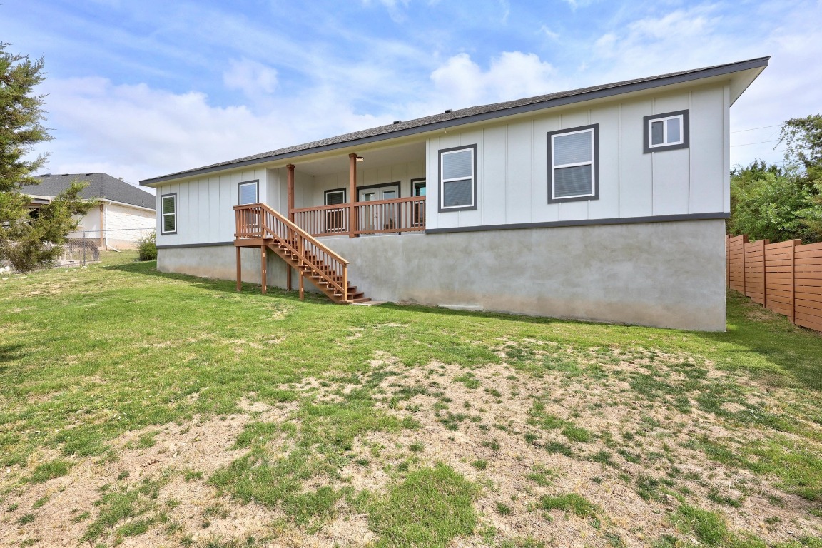 17701 Village Drive Dripping Springs, TX 78620 - Photo 33 of 36 a backyard of a house with table and chairs