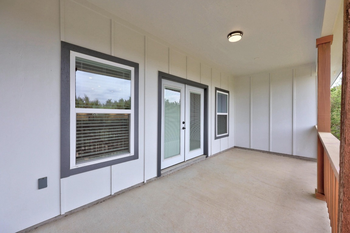 17701 Village Drive Dripping Springs, TX 78620 - Photo 34 of 36 a view of an empty room with a window and a kitchen