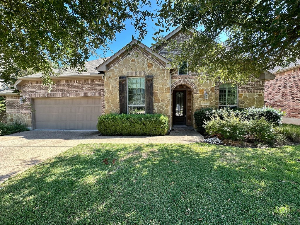 106 Shetland Lane Cedar Park, TX 78613 - Photo 1 of 31 a front view of a house with a garden and plants