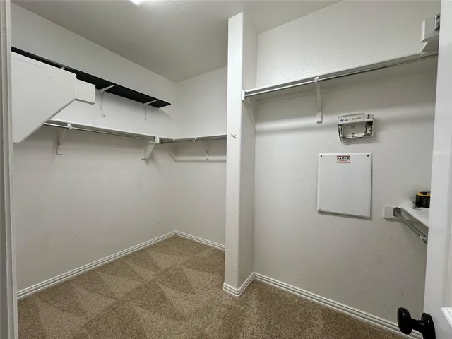 a view of a room with racks on the wall