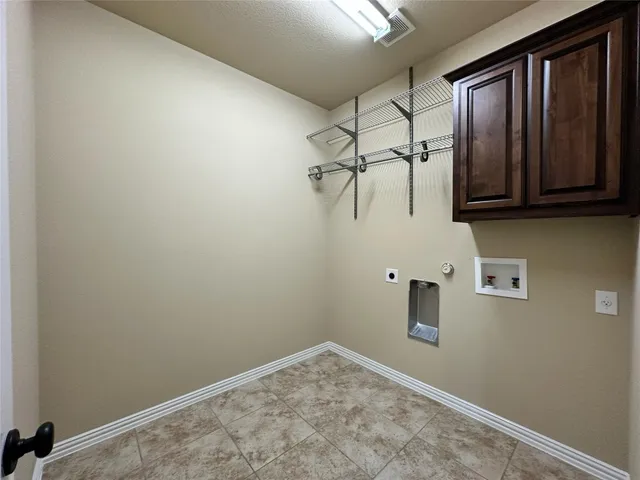 view of a room with rack on the wall