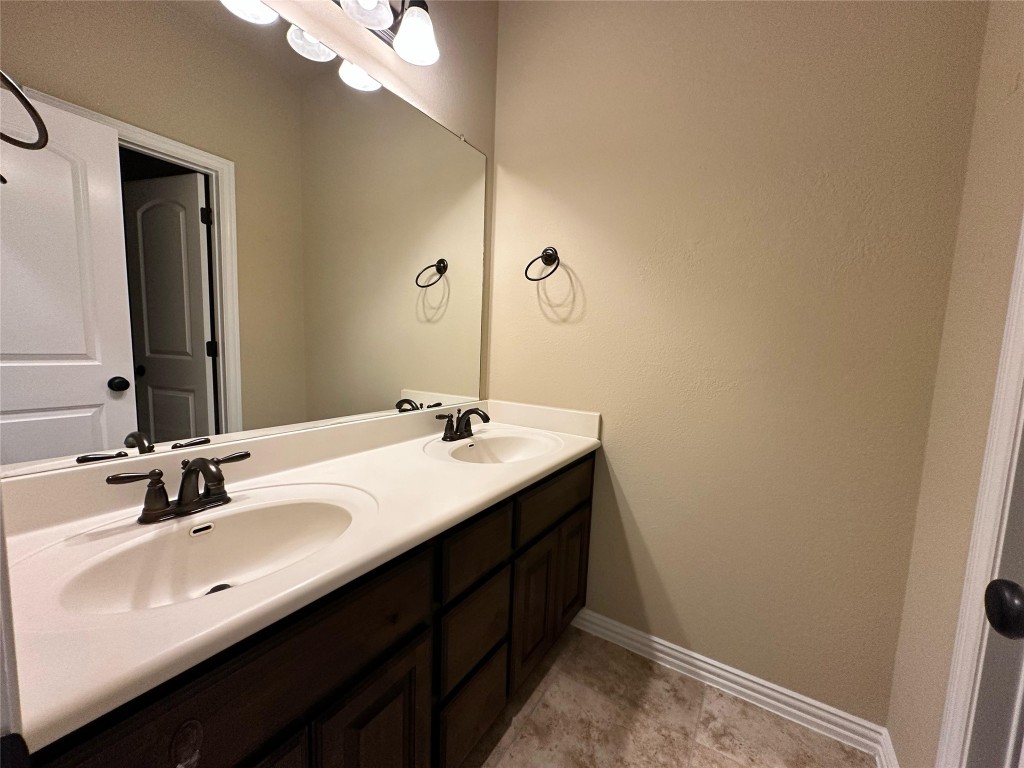 106 Shetland Lane Cedar Park, TX 78613 - Photo 21 of 31 a bathroom with a double vanity sink and a mirror