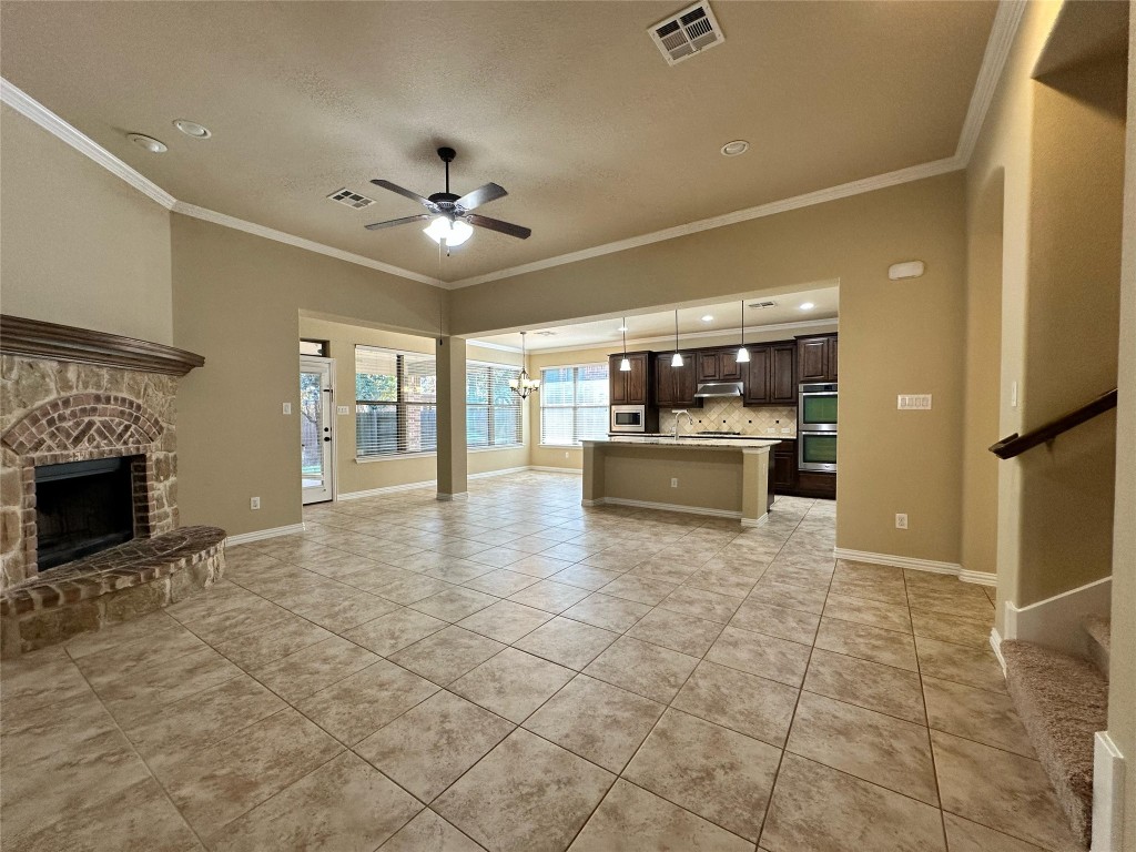 106 Shetland Lane Cedar Park, TX 78613 - Photo 22 of 31 a view of a kitchen with a sink and a fireplace