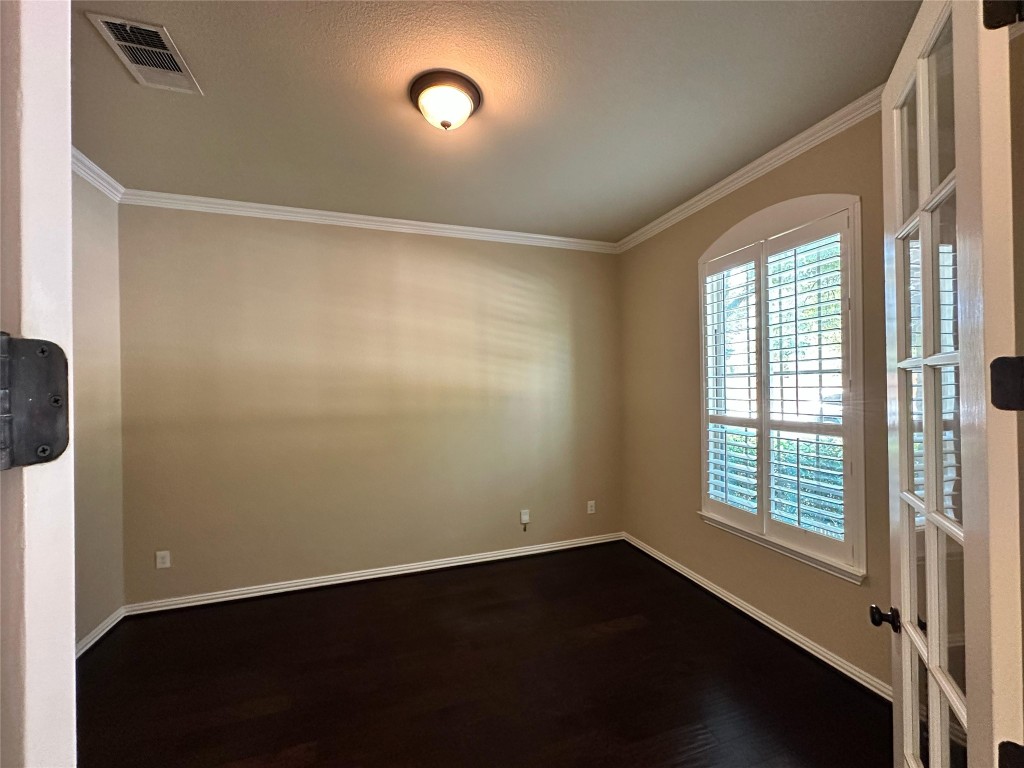 106 Shetland Lane Cedar Park, TX 78613 - Photo 5 of 31 an empty room with wooden floor and windows