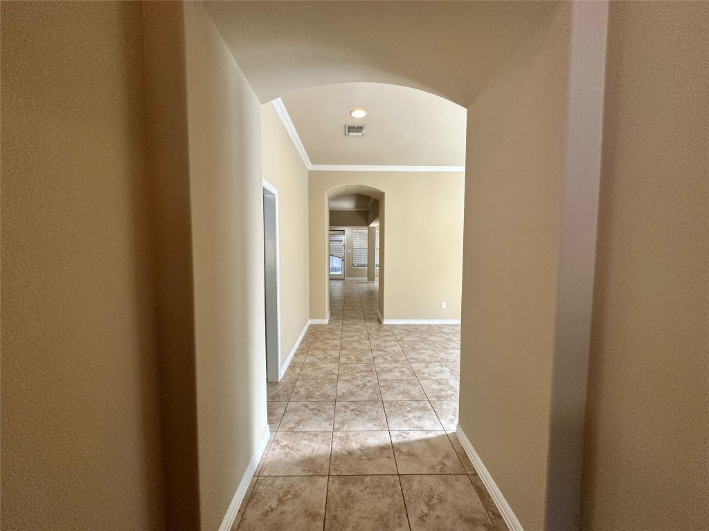 106 Shetland Lane Cedar Park, TX 78613 - Photo 6 of 31 a view of a hallway with wooden floor and a living room