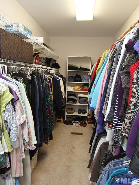 11618 John Allen Road Raleigh, NC 27614 - Photo 12 of 25 a view of walk in closet with clothes and shoes
