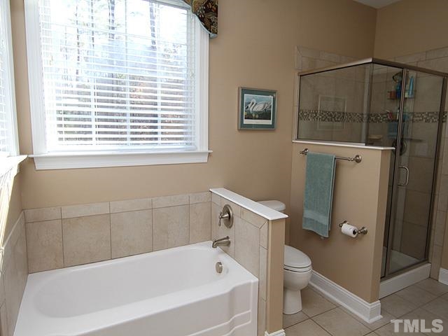 11618 John Allen Road Raleigh, NC 27614 - Photo 13 of 25 a bathroom with a bathtub and a toilet