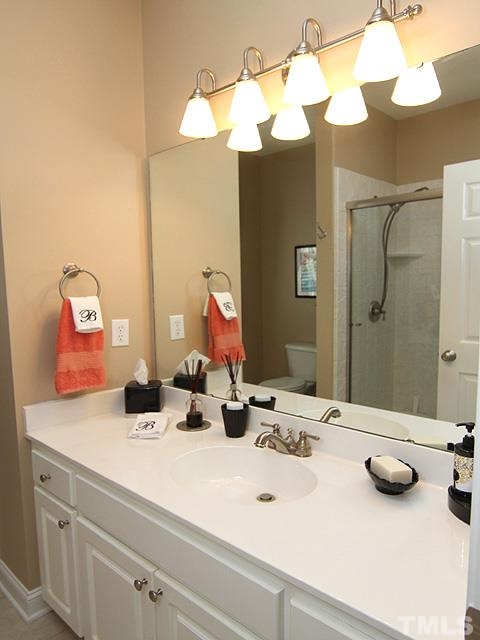 11618 John Allen Road Raleigh, NC 27614 - Photo 17 of 25 a bathroom with a sink and a mirror