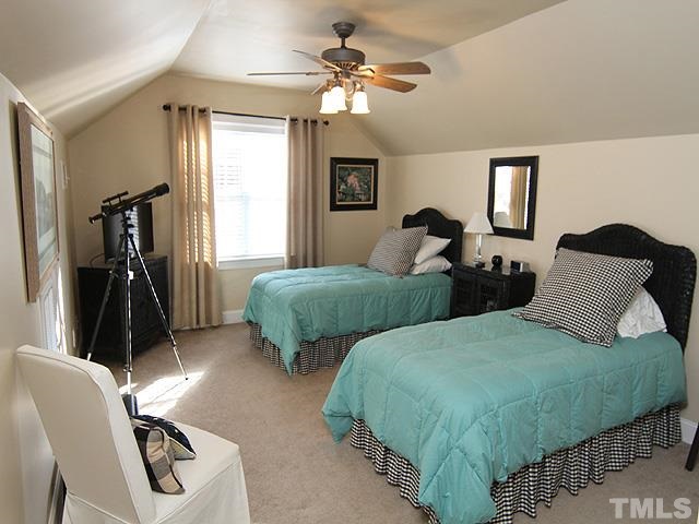 11618 John Allen Road Raleigh, NC 27614 - Photo 19 of 25 a bedroom with two beds and a chandelier