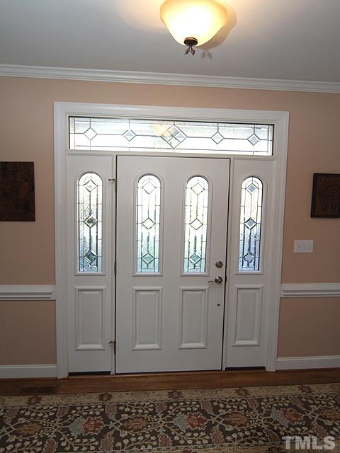 11618 John Allen Road Raleigh, NC 27614 - Photo 24 of 25 a view of entryway with wooden floor