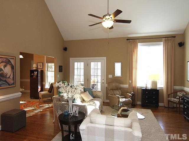 11618 John Allen Road Raleigh, NC 27614 - Photo 25 of 25 a living room with furniture chandelier and a large window