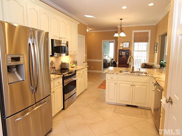 11618 John Allen Road Raleigh, NC 27614 - Photo 8 of 25 a kitchen with stainless steel appliances a refrigerator sink and microwave