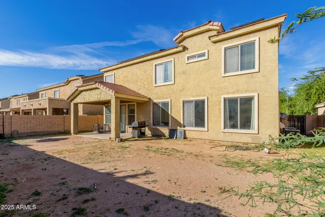 a view of house with backyard of the house