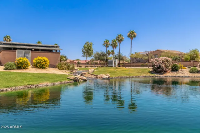 a view of a lake with a house in the background