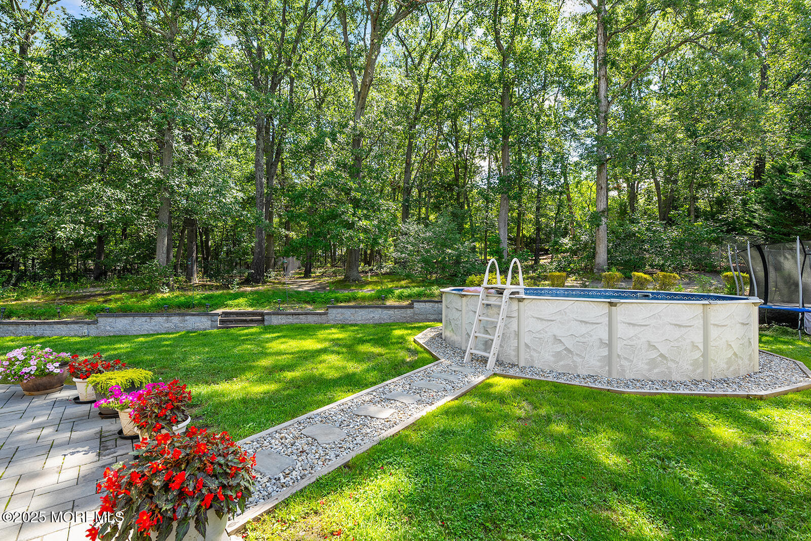26 Chiswick Court Jackson, NJ 08527 - Photo 31 of 41 a view of a garden with a bench