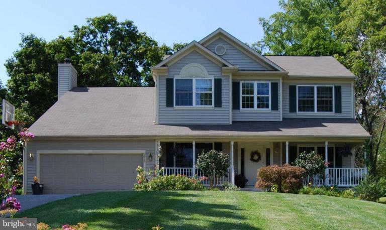 3648 Valley Road Ellicott City, MD 21042 - Photo 1 of 30 a front view of a house with a yard and porch