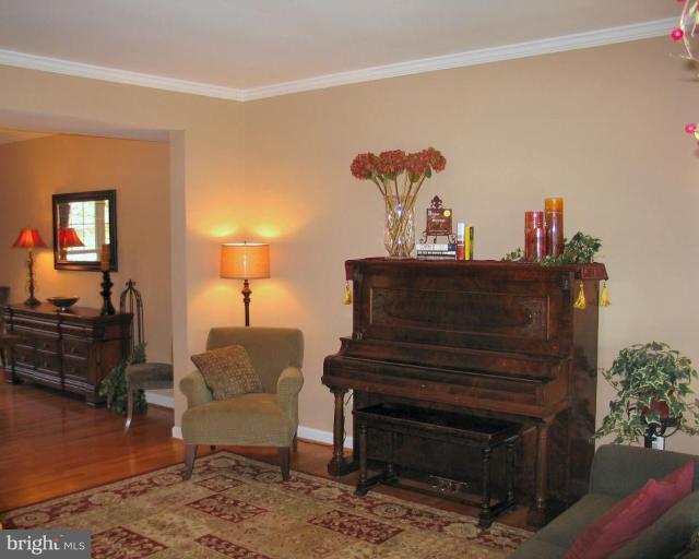 3648 Valley Road Ellicott City, MD 21042 - Photo 11 of 30 a living room with furniture and a fireplace
