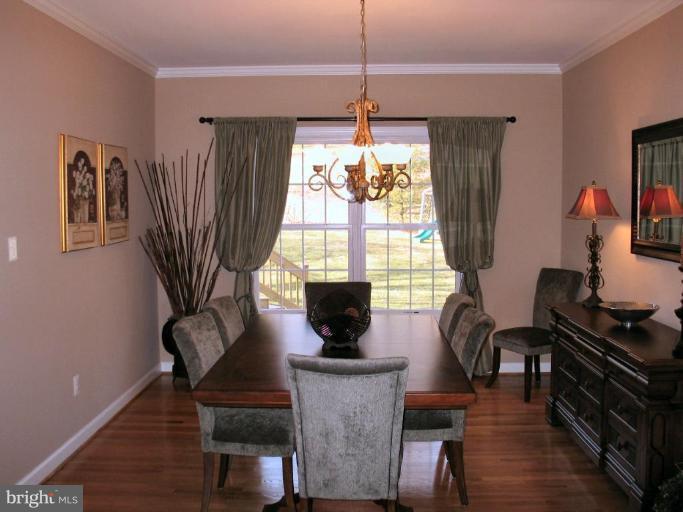 3648 Valley Road Ellicott City, MD 21042 - Photo 12 of 30 a living room with furniture a window and a chandelier