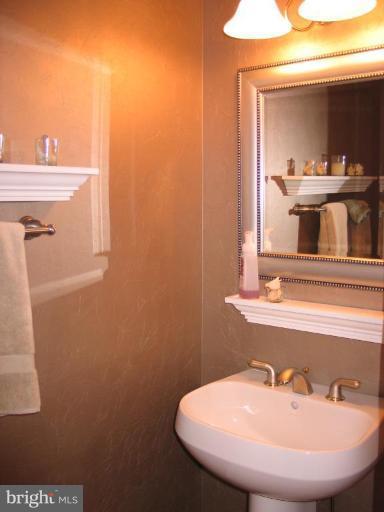 3648 Valley Road Ellicott City, MD 21042 - Photo 13 of 30 a bathroom with a sink and a mirror